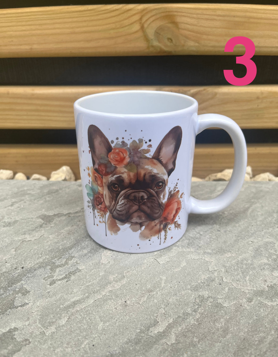 White mug with a dog illustration on a stone surface