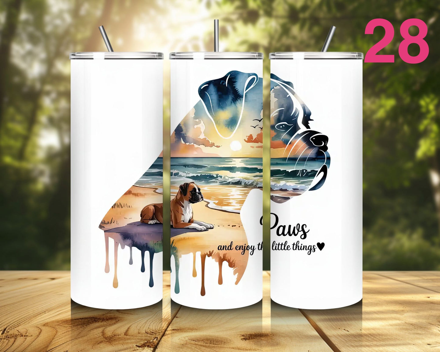 White tumbler with dog design and 'Paws and enjoy the little things' text on a wooden surface with nature background.