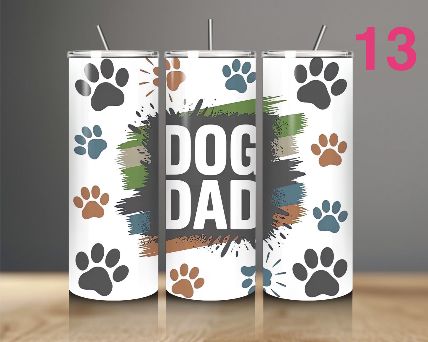 Three tumblers with 'DOG DAD' text and paw prints on a white background.