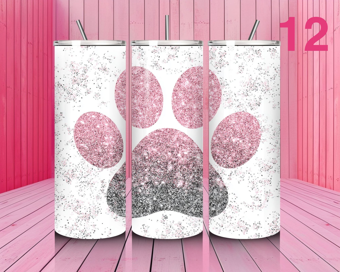 Three glittery paw print tumblers on a pink wooden background with the number 12.