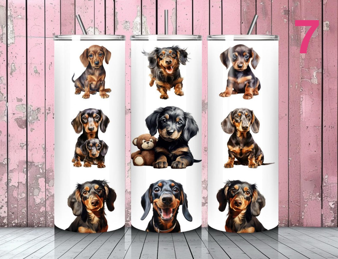 Tumblers with images of dachshunds on a pink wooden background