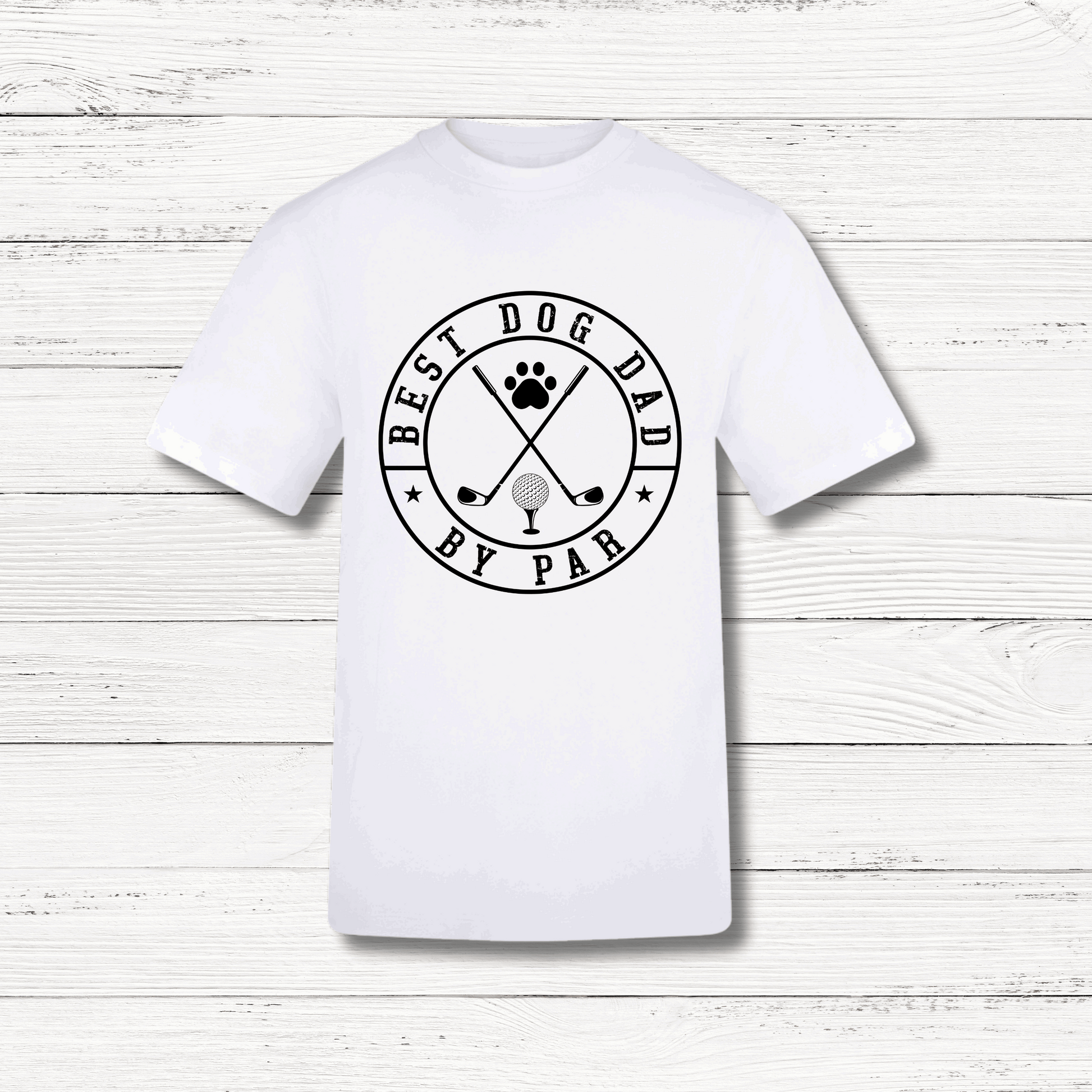 White t-shirt with 'Best Dog Dad by Par' graphic on a wooden surface