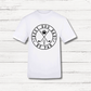 White t-shirt with 'Best Dog Dad by Par' graphic on a wooden surface
