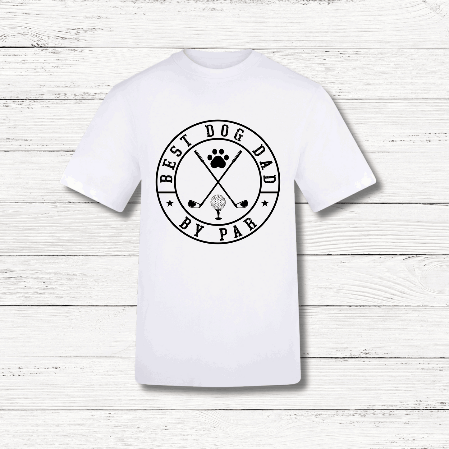 White t-shirt with 'Best Dog Dad by Par' graphic on a wooden surface