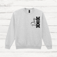 Gray sweatshirt with a black graphic design on a white wooden background