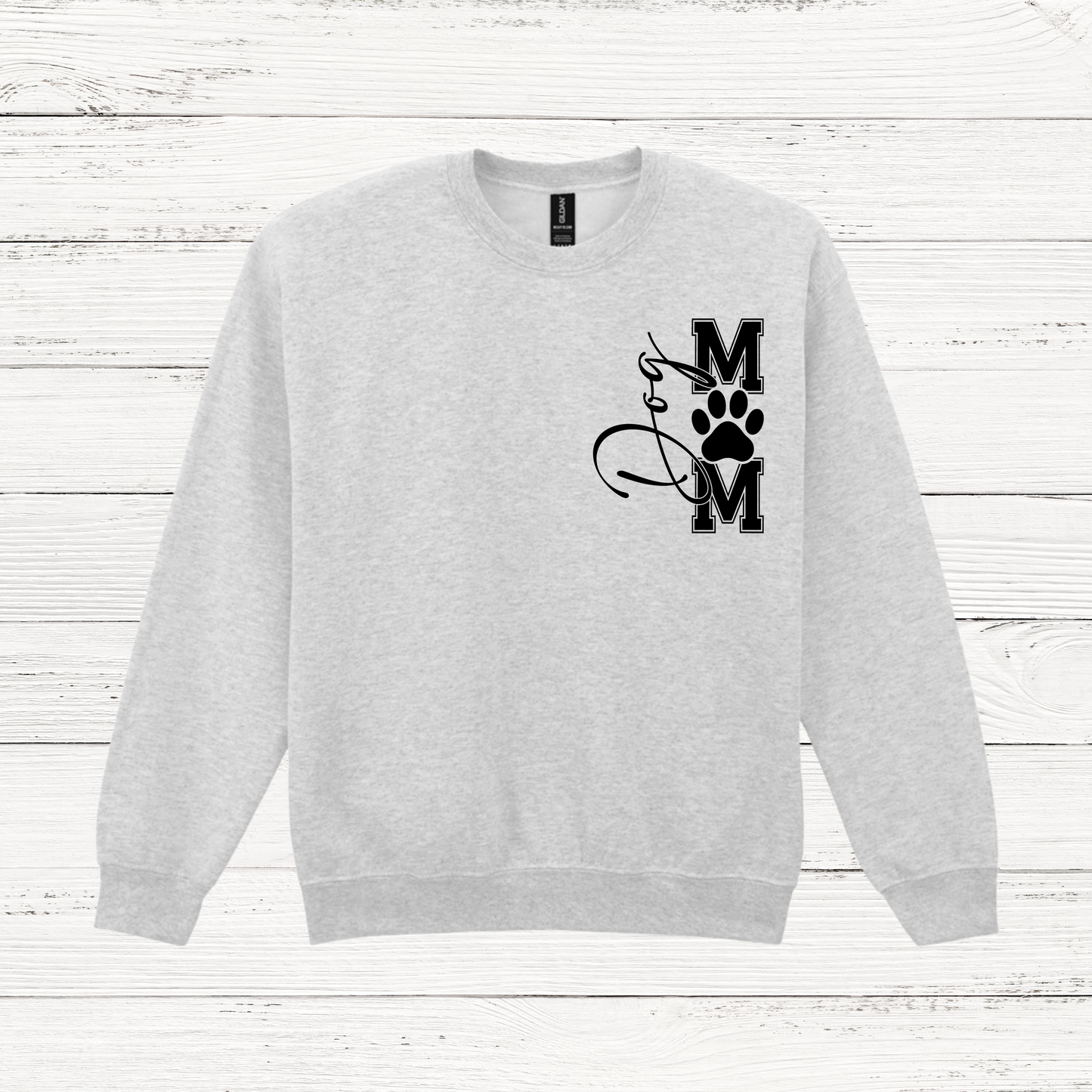 Gray sweatshirt with a black graphic design on a white wooden background