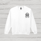 White sweatshirt with a dog illustration and 'Sam's Dad' text on a wooden surface
