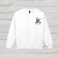 White sweatshirt with a black dog illustration and text on a wooden surface
