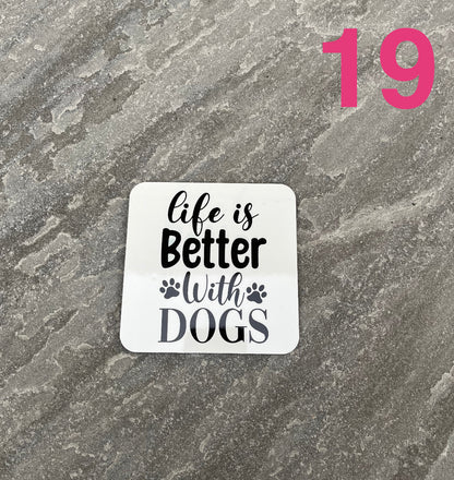 Sticker with 'Life is Better With Dogs' text on a textured gray background