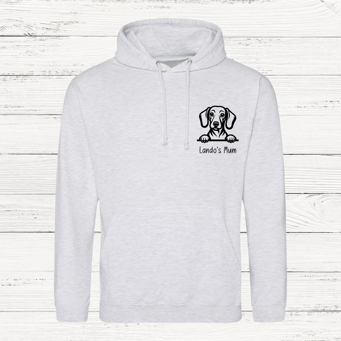 grey hoodie with a dog graphic and text on a wooden background
