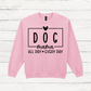 Pink sweatshirt with 'DOG mama ALL DAY EVERY DAY' text on a wooden surface