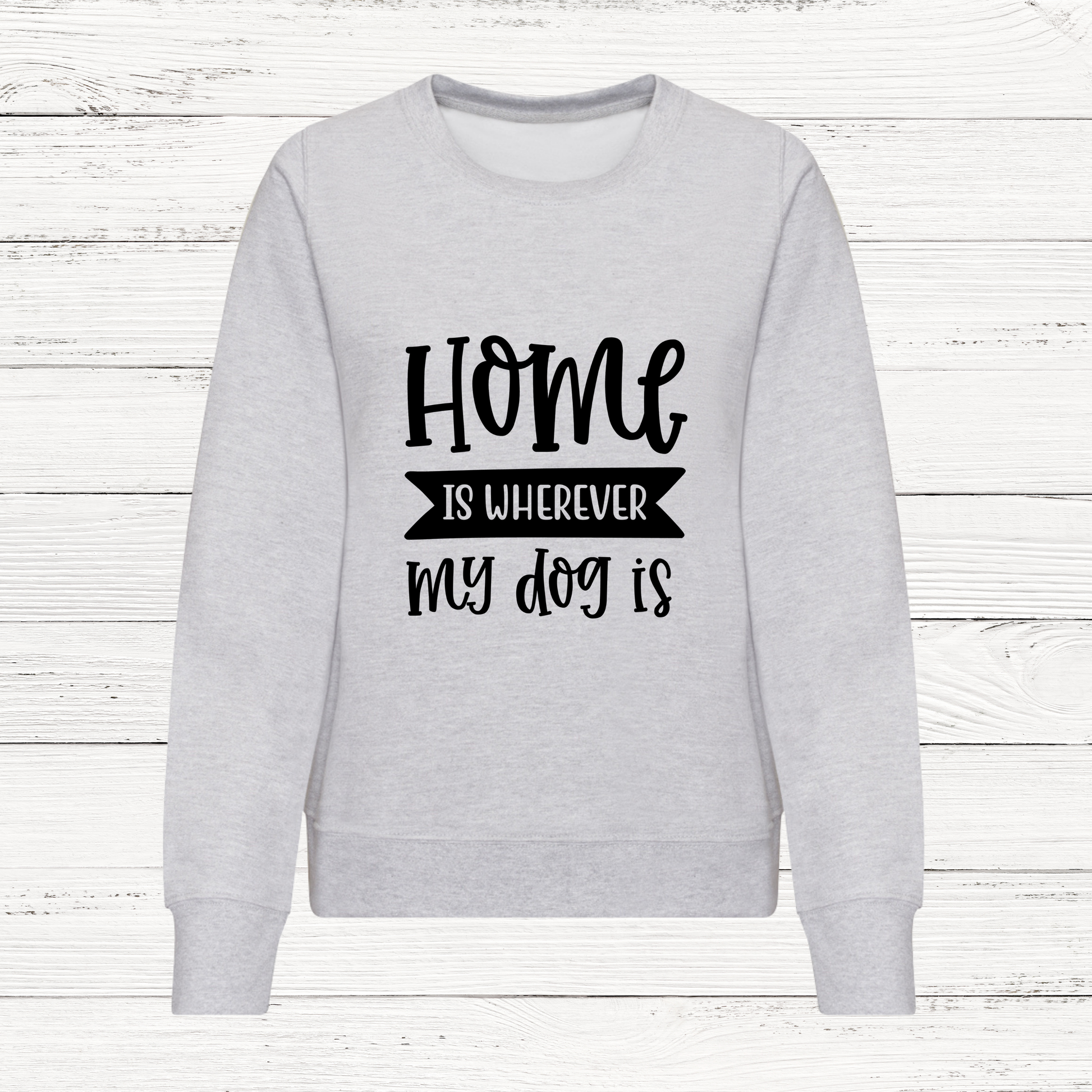 Gray sweatshirt with 'Home is wherever my dog is' text on a white wooden background
