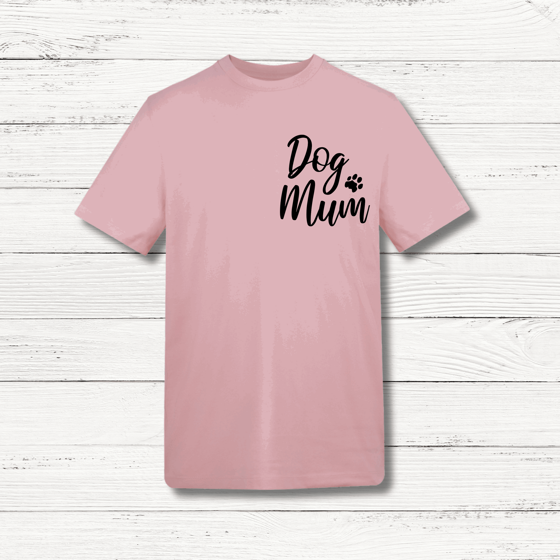 Pink t-shirt with 'Dog Mum' text on a wooden surface