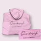 Pink hoodie with 'Dance Company' print on a light gray background