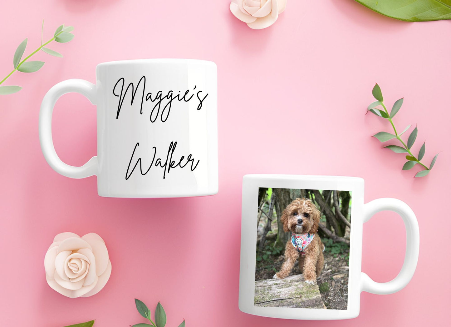 Two mugs on a pink background with one displaying 'Maggie's Walker' text and the other featuring a dog photo.