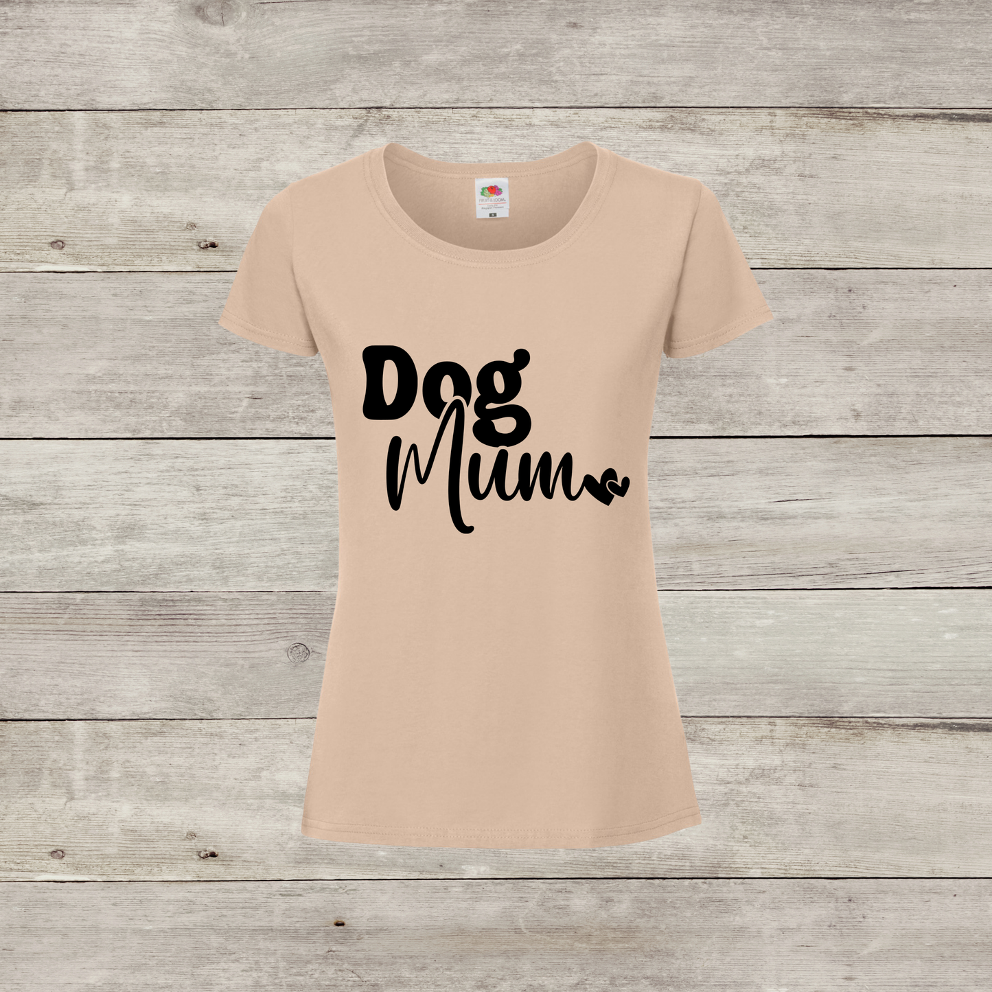 Beige t-shirt with 'Dog Mum' text on a wooden surface