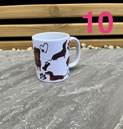 White mug with dachshund illustrations on a stone surface with wooden background
