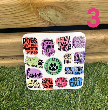 Sheet of colorful dog-themed stickers on a grass and wooden background