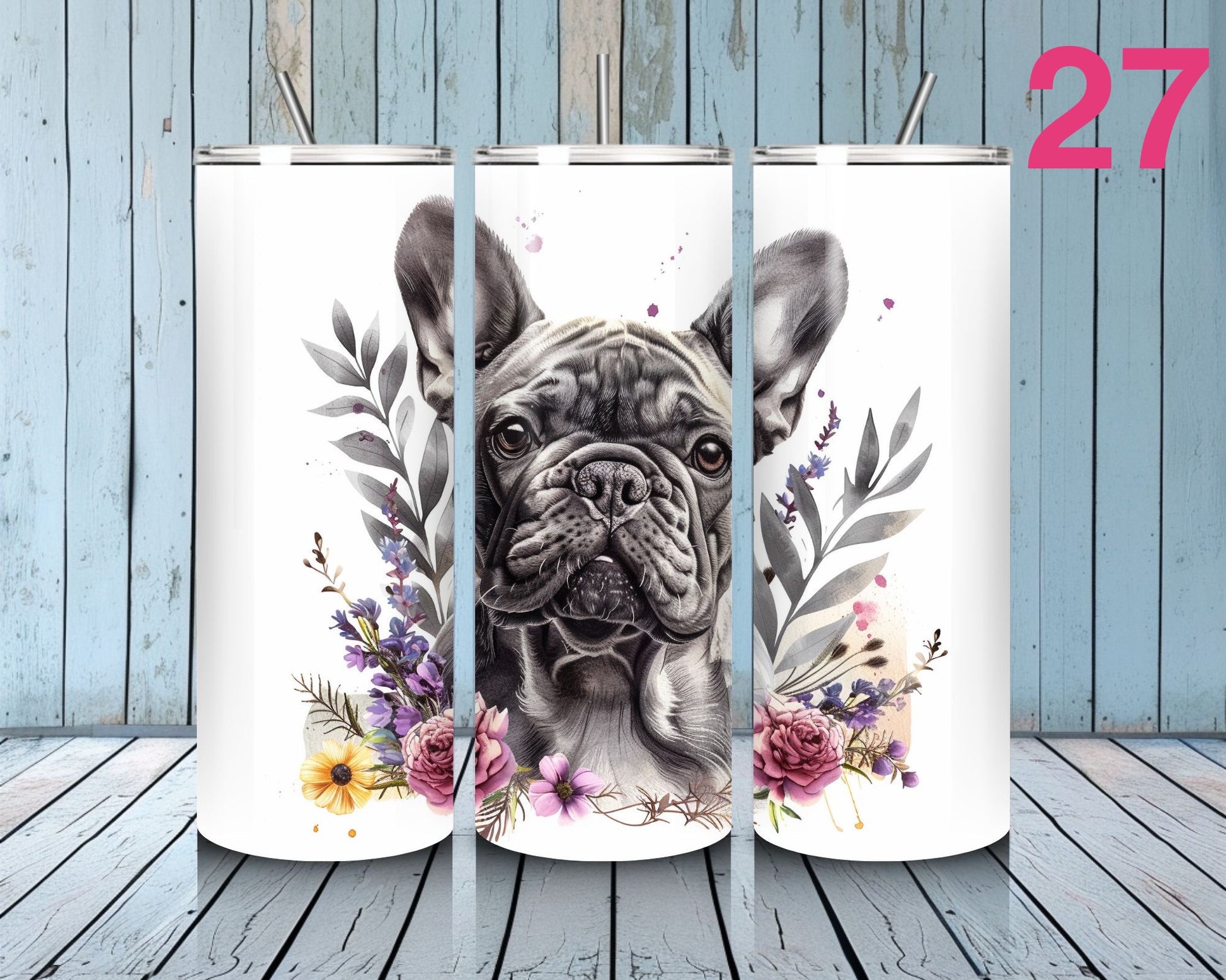 Three tumblers with a dog illustration and floral design on a wooden surface.
