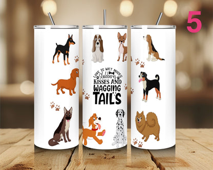 Three tumblers with dog illustrations and text on a wooden surface.