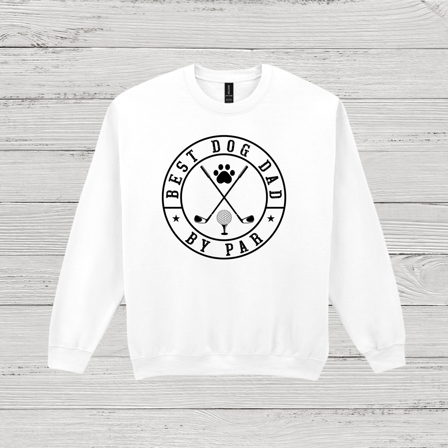White sweatshirt with 'Best Dog Dad by Par' text on a wooden surface