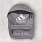 Gray backpack with 'Heart & Hound' logo and contact number on a light gray background