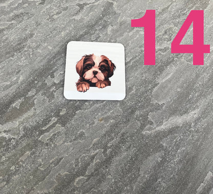 Sticker of a dog on a textured gray surface with the number 14.