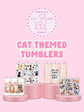 Cat-themed tumblers on pink stands with 'Pawsitively Purrfect' branding on a pink background.