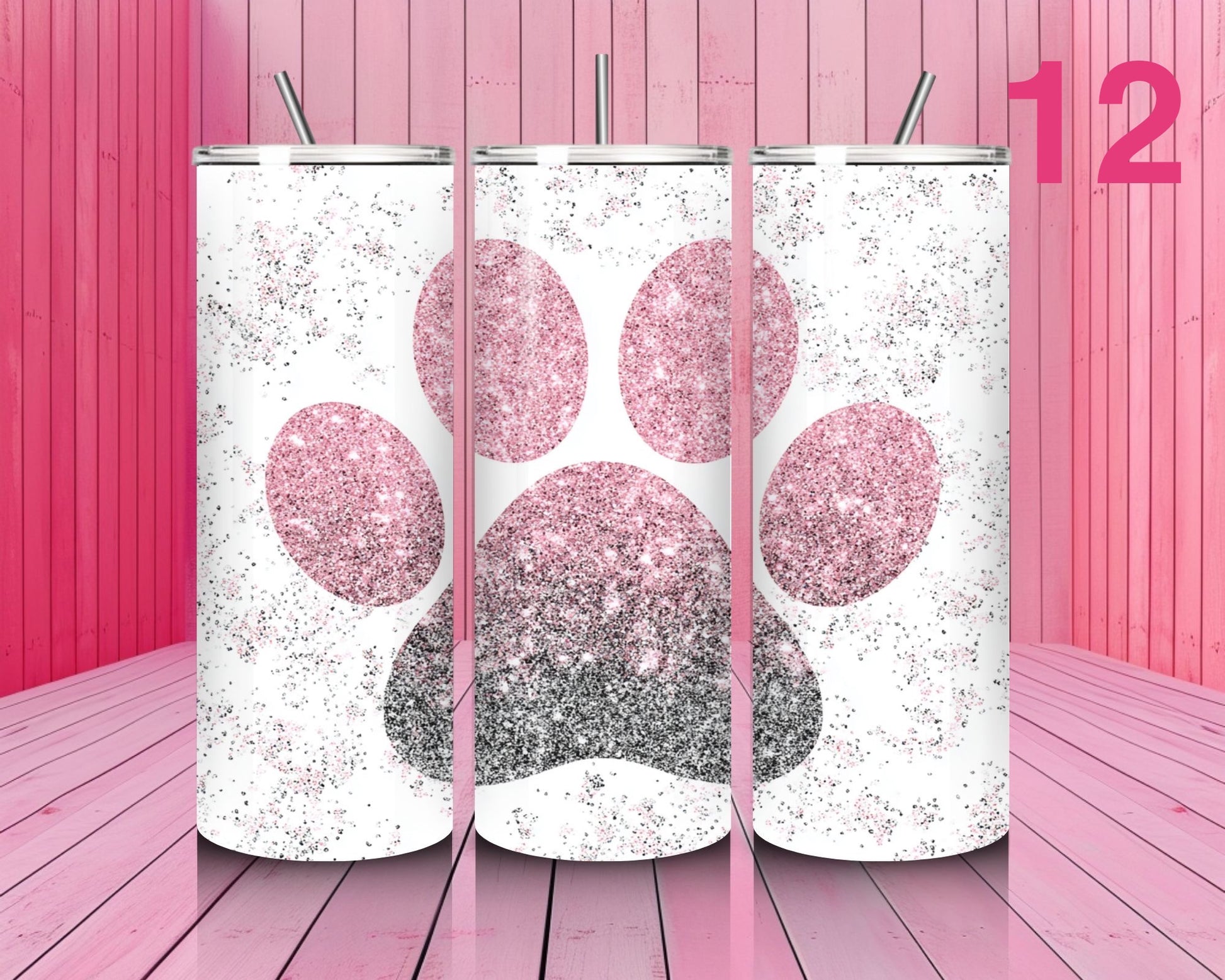 Three glittery paw print tumblers on a pink wooden background with the number 12.