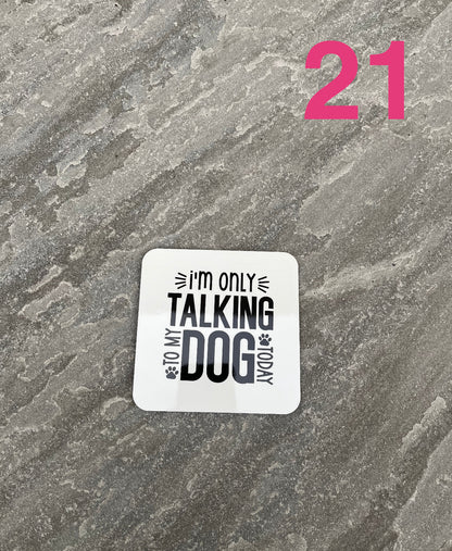 Sticker with text 'I'm only talking to my dog' on a textured gray background with number 21.