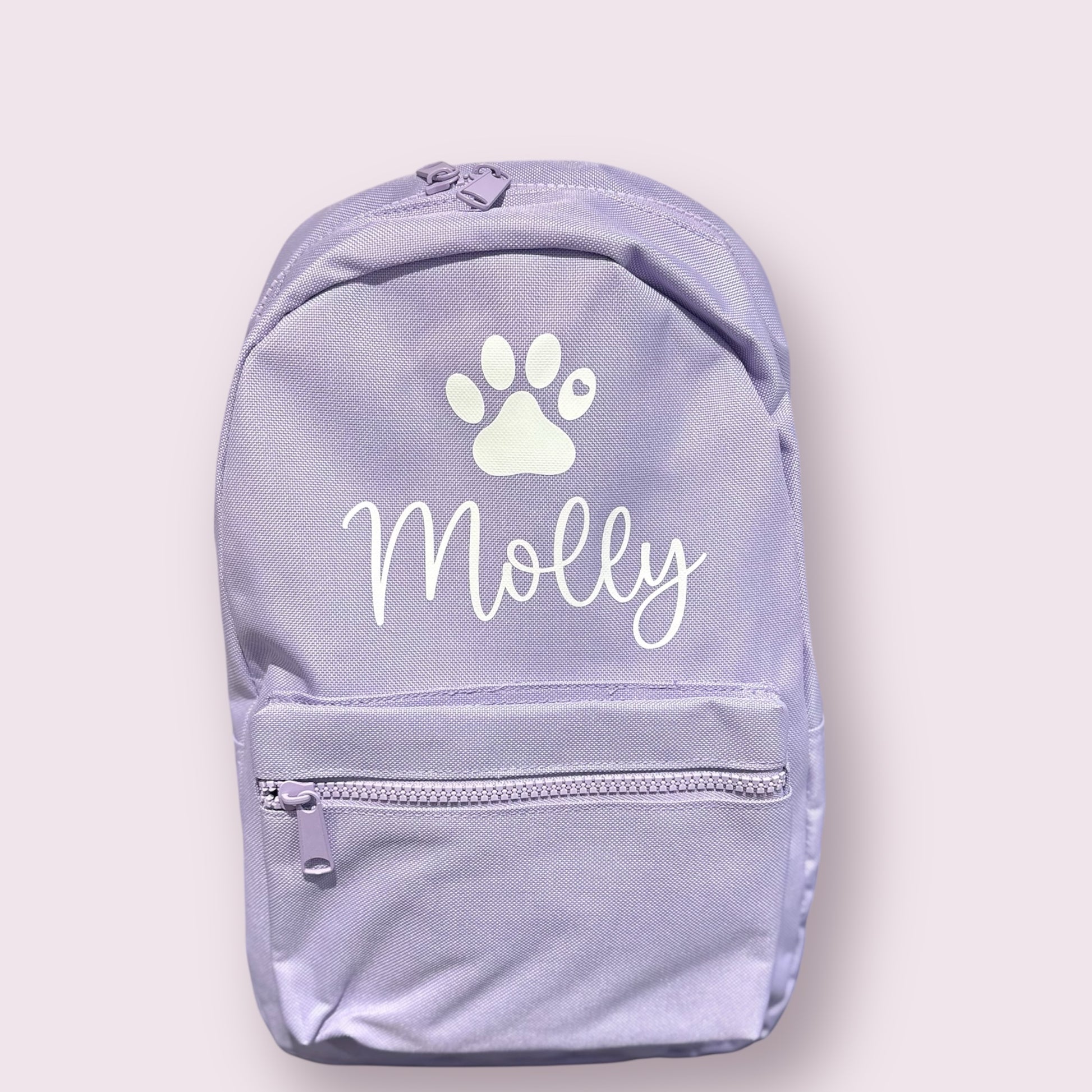 Light purple backpack with a white paw print and 'Molly' text on a light gray background