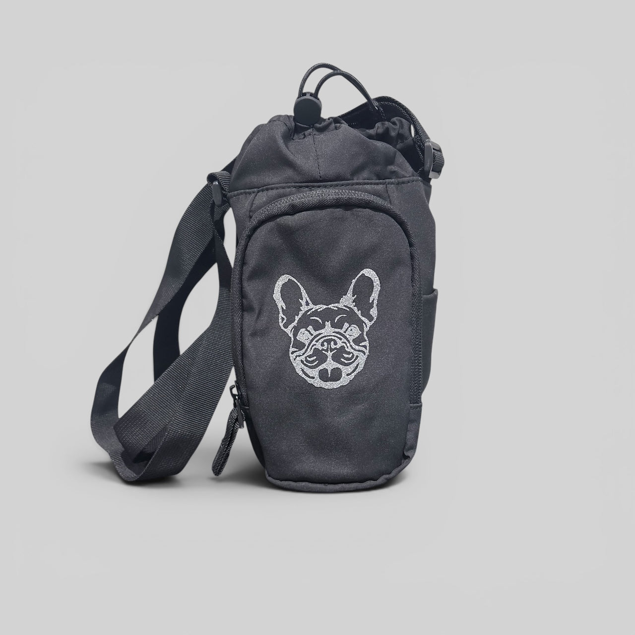Black shoulder bag with a dog face design on a light gray background