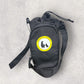 Black bottle bag with a yellow and white logo on a gray background