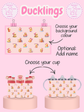 Product display with duckling-themed items including a chart, cups, and bottles on a pink background.