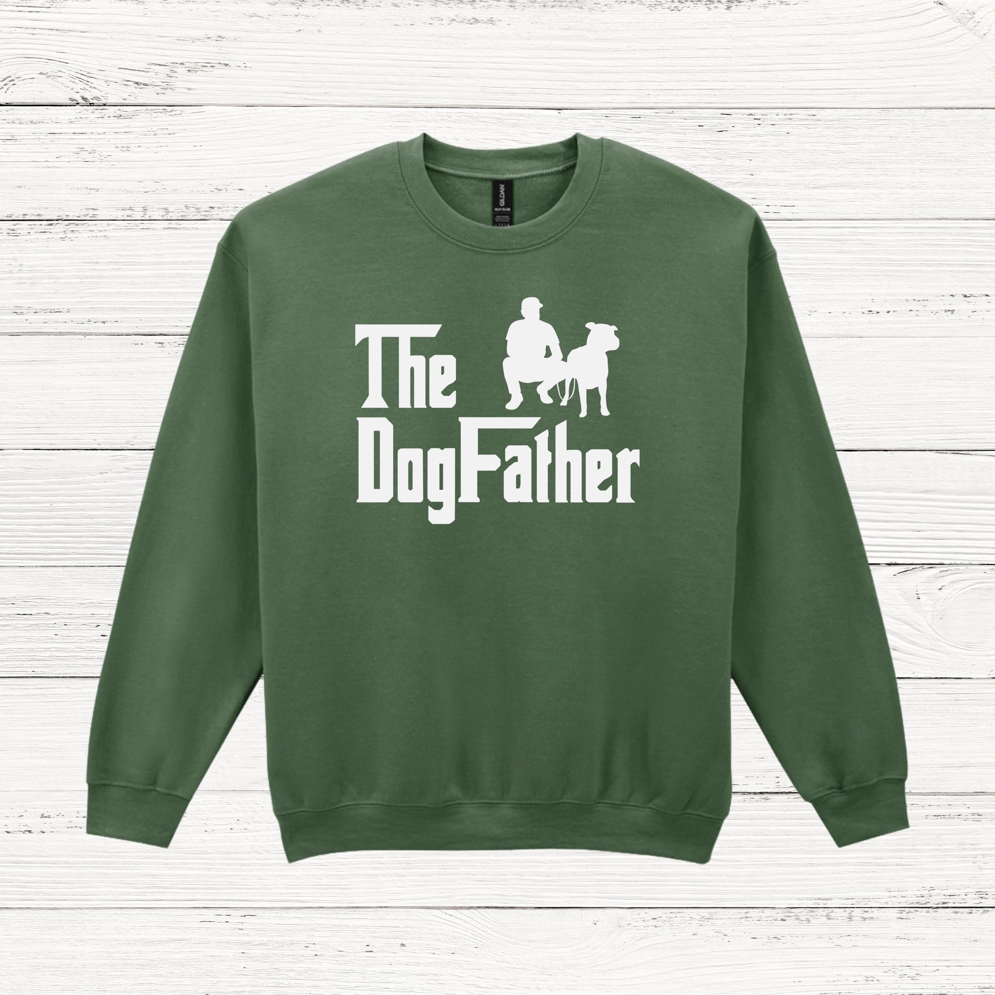 Green sweatshirt with 'The Dog Father' text and graphic on a wooden surface