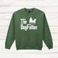 Green sweatshirt with 'The Dog Father' text and graphic on a wooden surface