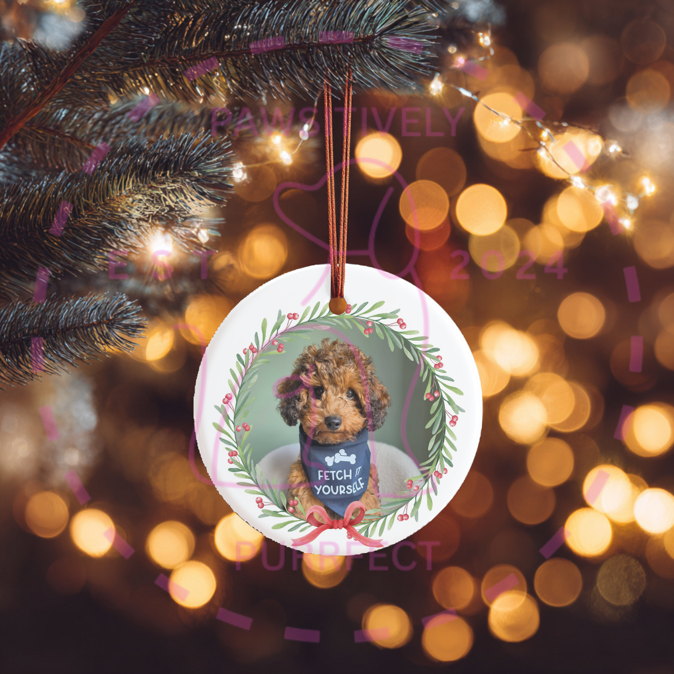 Close-up of a personalised Christmas bauble featuring a custom photo inside a festive wreath, perfect for family and pet keepsakes.