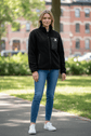 Woman wearing a black borg fleece workwear jacket outdoors